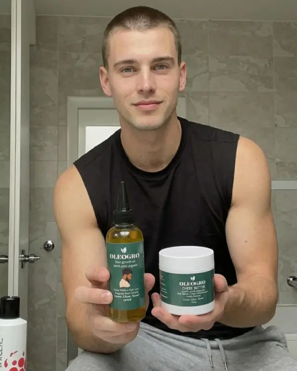 Man holding Oleogro hair growth oil and chebe butter duo