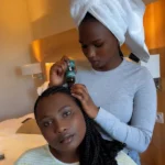 Applying Oleogro Hair Growth Oil to braided scalp